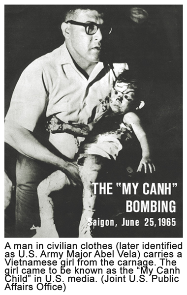 A man in civilian clothes (later identified as U.S. Army Major Abel Vela) carries a Vietnamese girl from the carnage. The girl came to be known as the “My Canh Child” in U.S. media. (Joint U.S. Public Affairs Office)